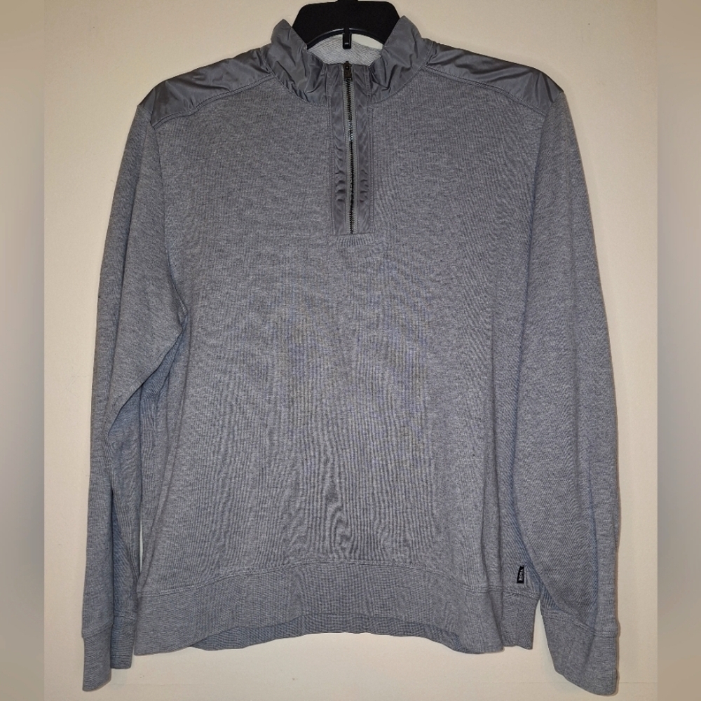 A Hugo Boss 1/4 zip pullover shirt/ jacket. Pre-loved with a stain on the sleeve
